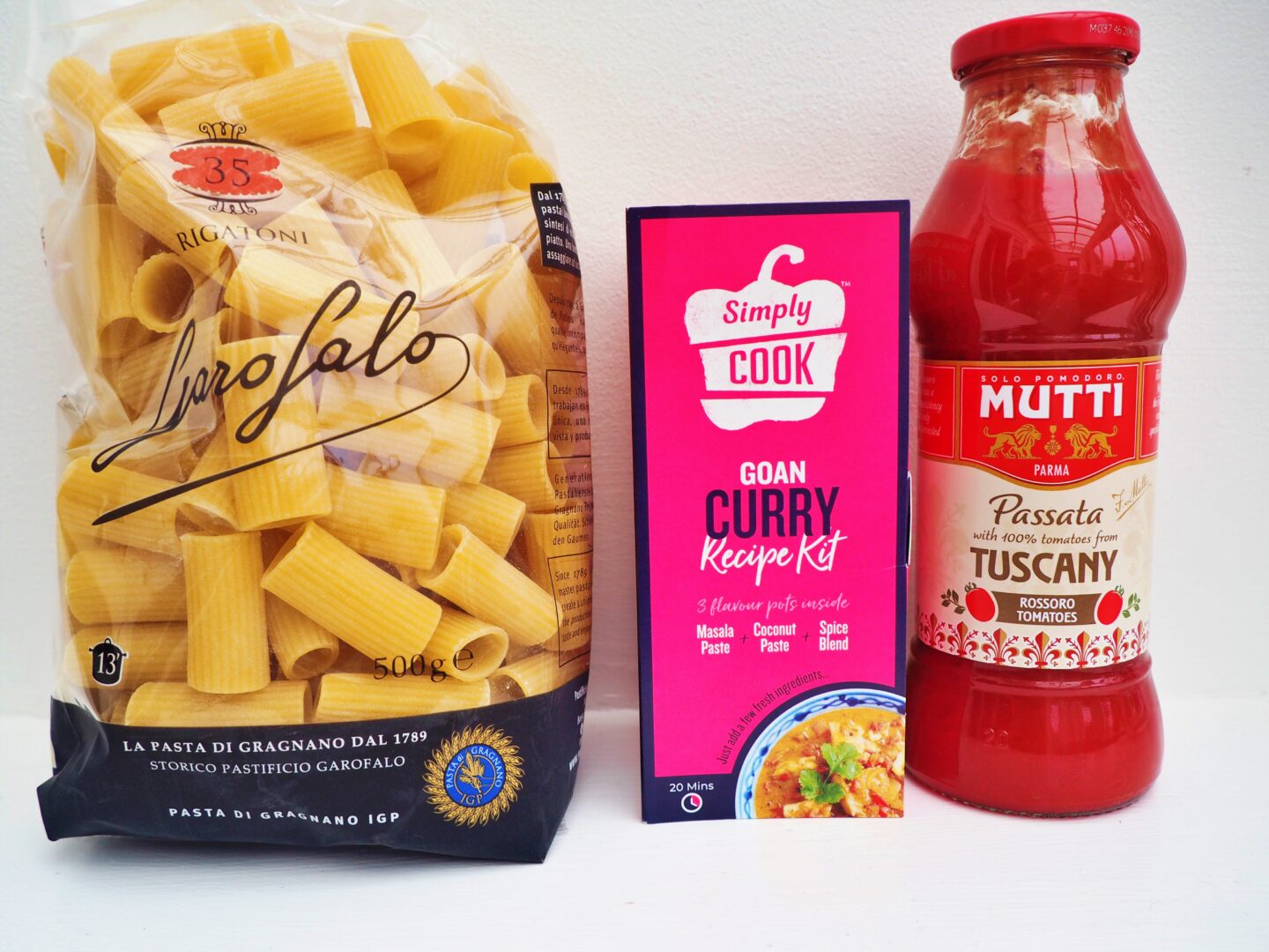 From left to right, a packet of Rigatoni pasta, a Simply Cook Goan curry and a bottle of Mutti Passata.