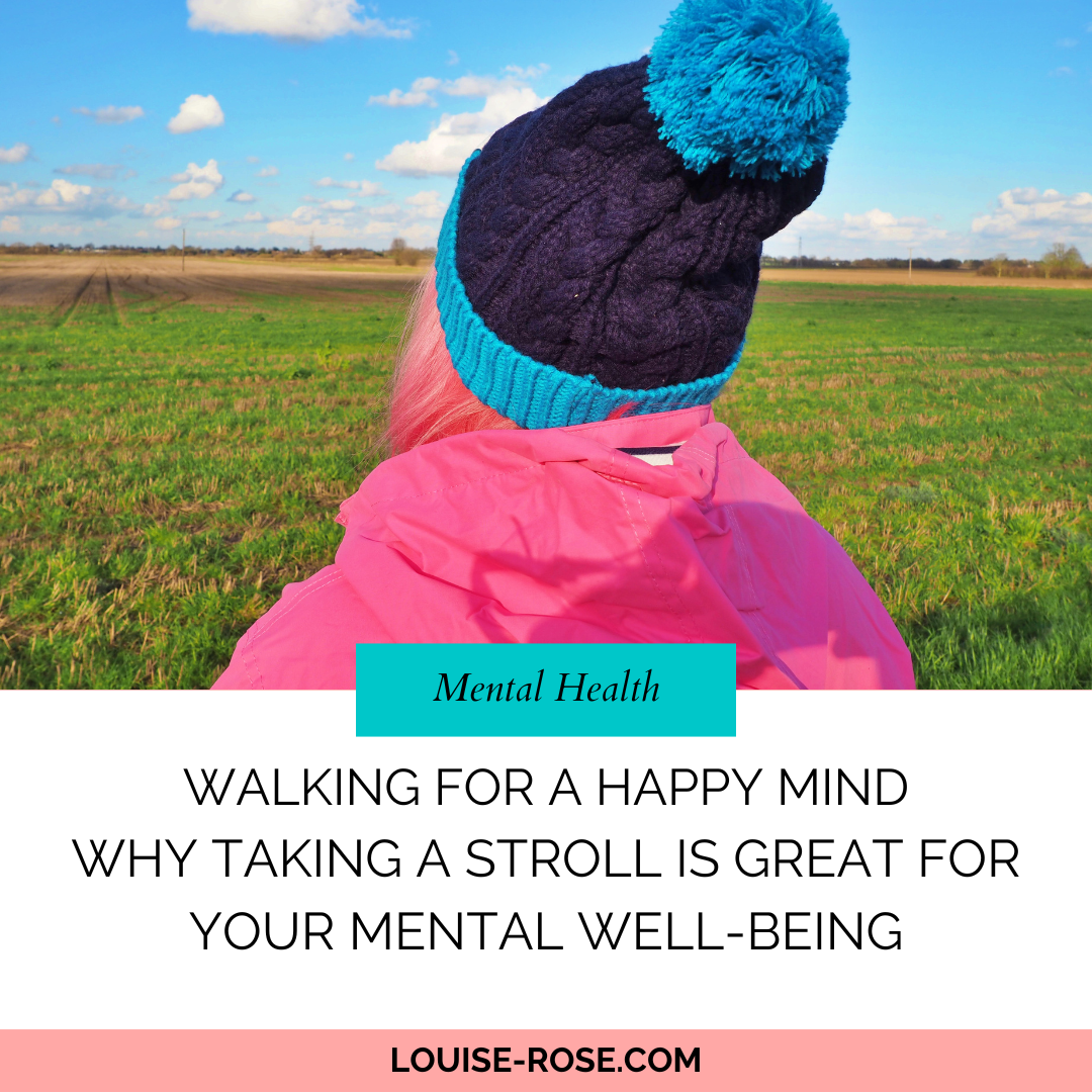 Image shows a photo of behind my head. I am wearing a navy and teal bobble hat, I have pink hair and I'm wearing a pink jacket. The text reads, Walking For A Happy Mind - Why Taking A Stroll Is Great For Your Mental Well-being. Louise-Rose.com