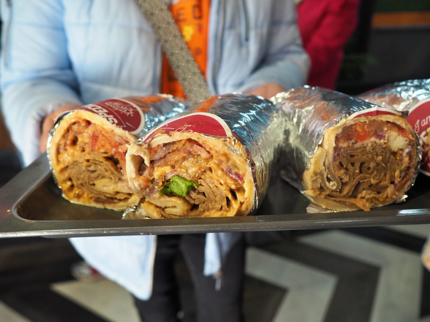 Photo shows 3 doner kebab wraps on a tray from IAMDÖNER Leeds.