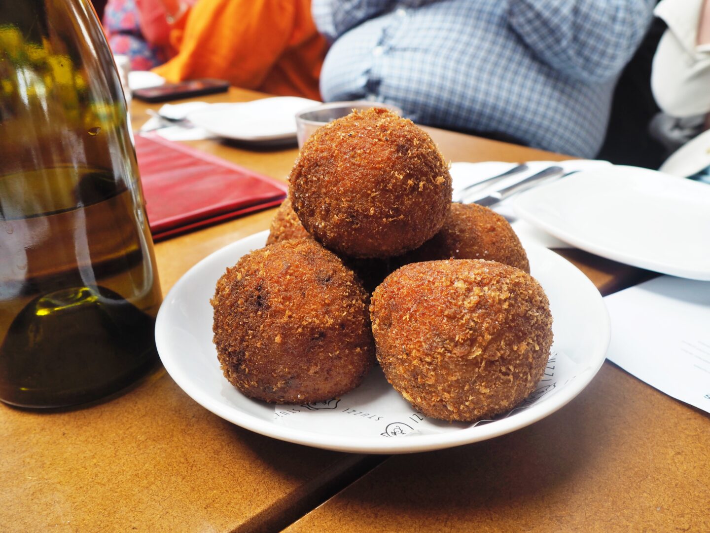 Photo shows a plate of arancini balls on a plate, at the restaurant Stuzzi in Leeds.