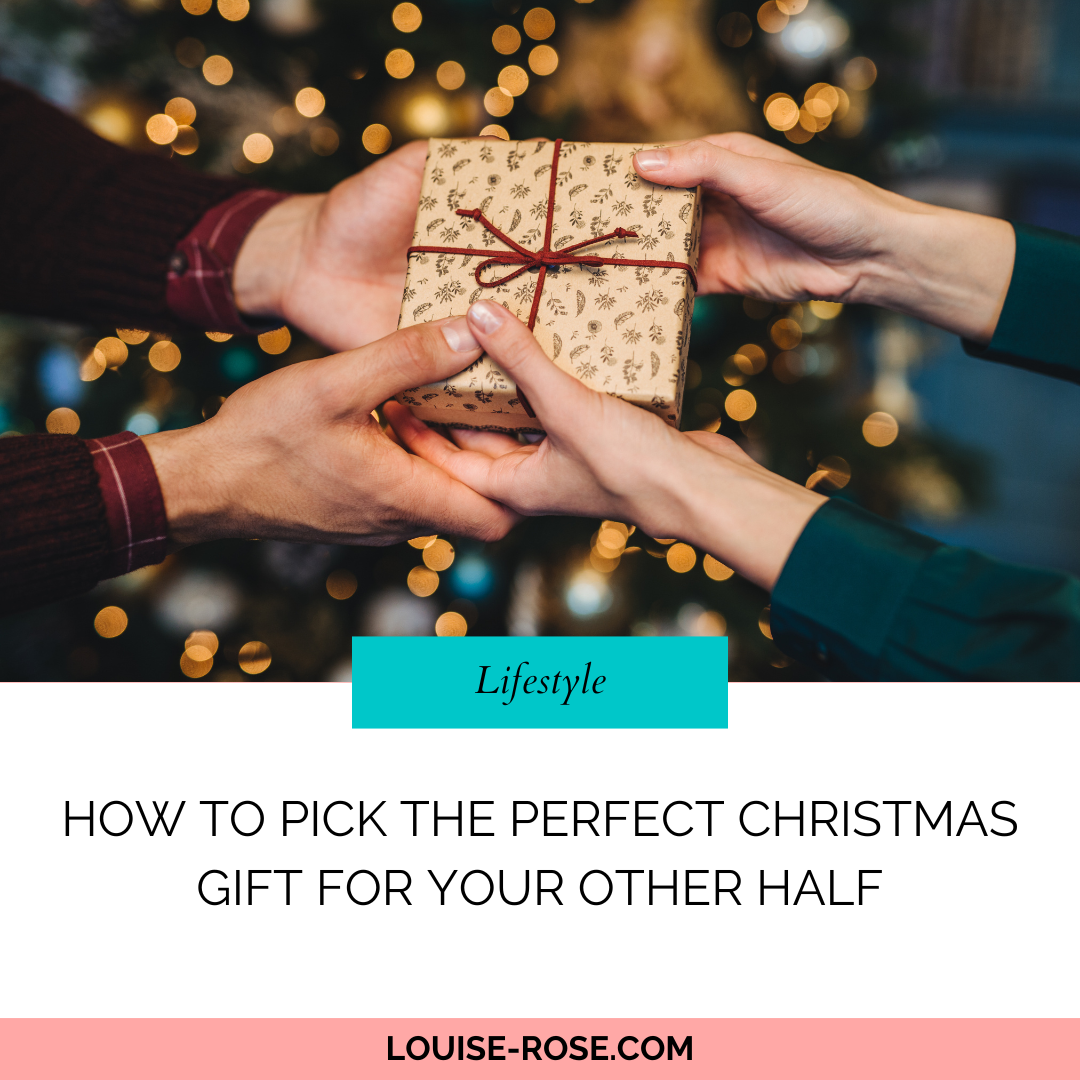 A person handing a wrapped Christmas gift to another person. There is a blurred Christmas tree with lights in the background. The text beneath reads, How To Pick The Perfect Christmas Gift For Your Other Half. Louise-Rose.com