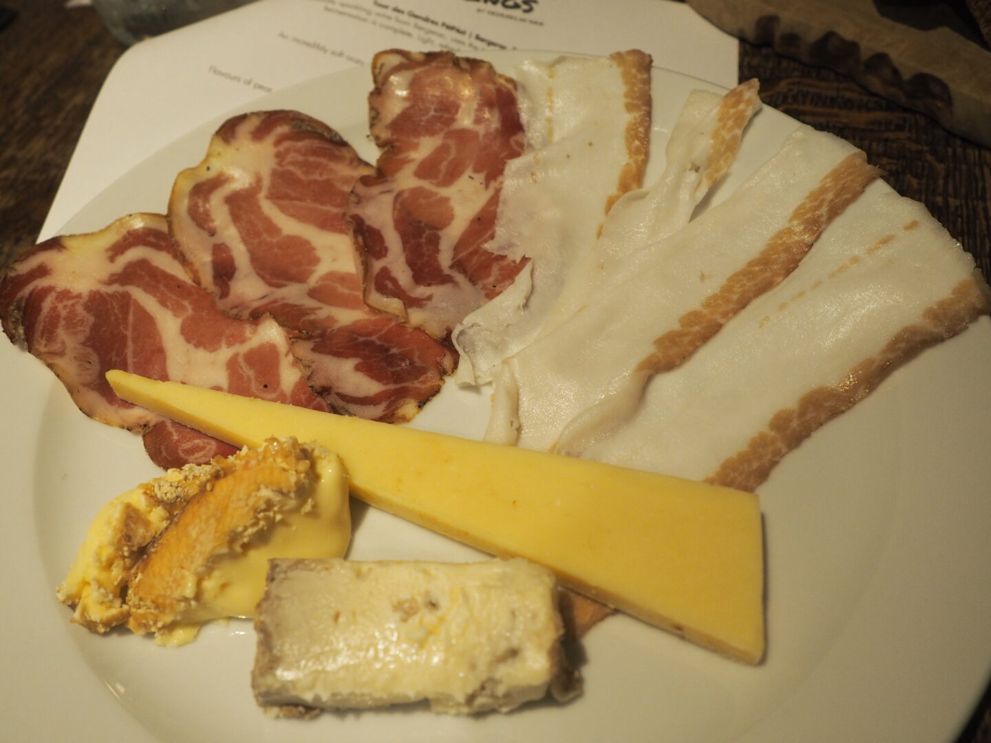 A plate of meat and cheese for the alpine wine pairing.